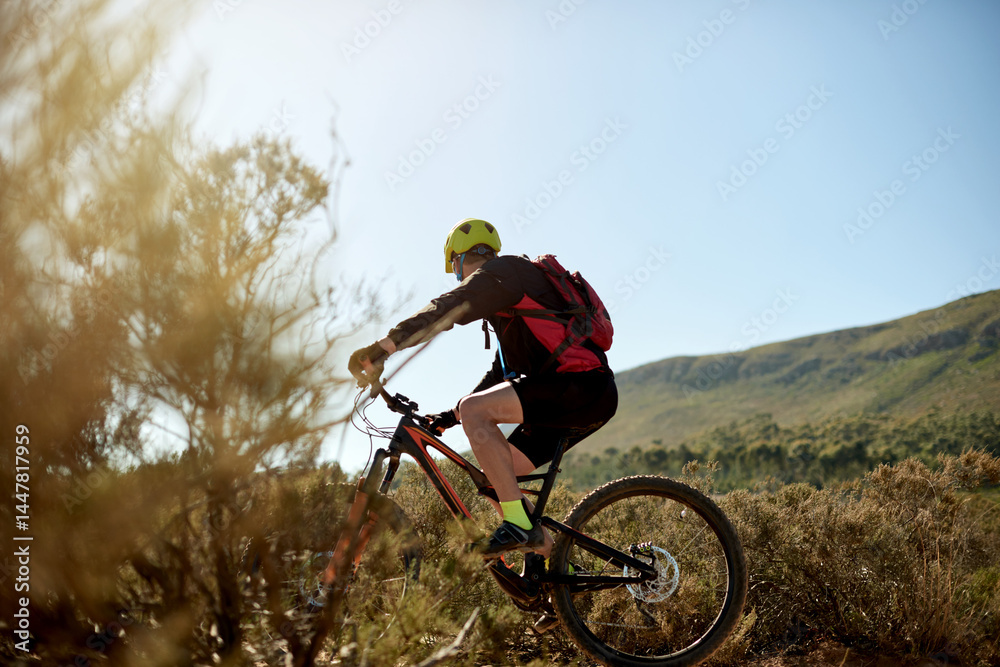 Fototapeta premium Nature, sports and man cycling on dirt road for gravel race, challenge or competition training. Fitness, mountain bike and athlete cyclist driving on trail outdoor for exercise or workout with speed.
