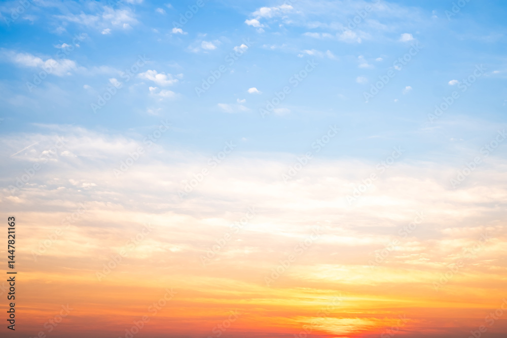 Obraz premium Beautiful , luxury soft gradient orange gold clouds and sunlight on the blue sky perfect for the background, take in evening,Twilight, Large size, high definition landscape photo