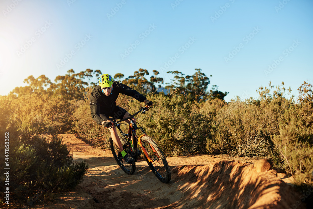 Naklejka premium Mountain bike, training and man with fitness, dirt road and environment with competition. Hobby, adrenaline or cyclist with practice, travel or challenge with adventure, journey or nature with energy