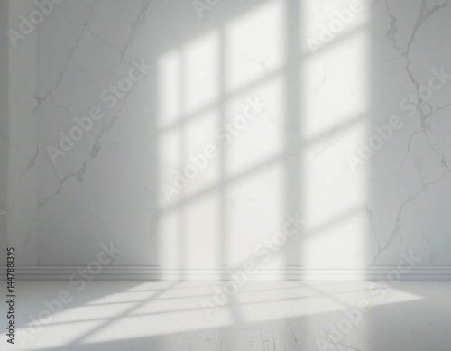 Bright interior with sharp sunlight forming window grids on the wall.