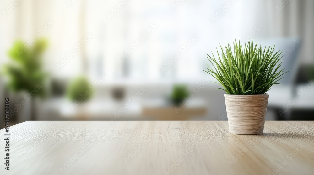 Fototapeta premium Minimalist workspace featuring potted plant on wooden table