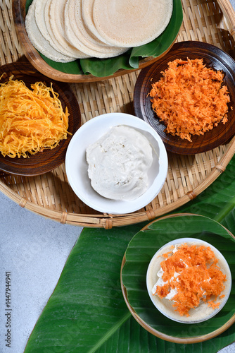 Vertical top view of Thai crispy pancakes topped with strips of egg yolks setup scenc