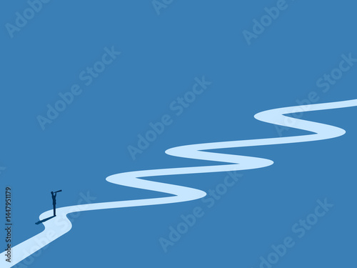 Businessman holding a telescope on a long winding path