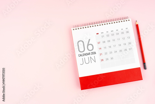 Top view June 2026 desk calendar and pencil, Position with copy space.