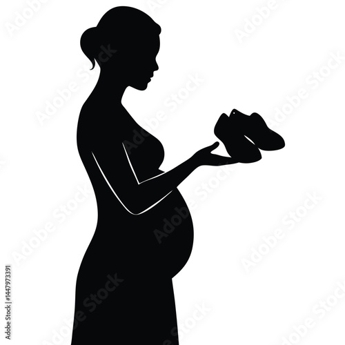 Expecting Mother Silhouette Holding Baby Shoes