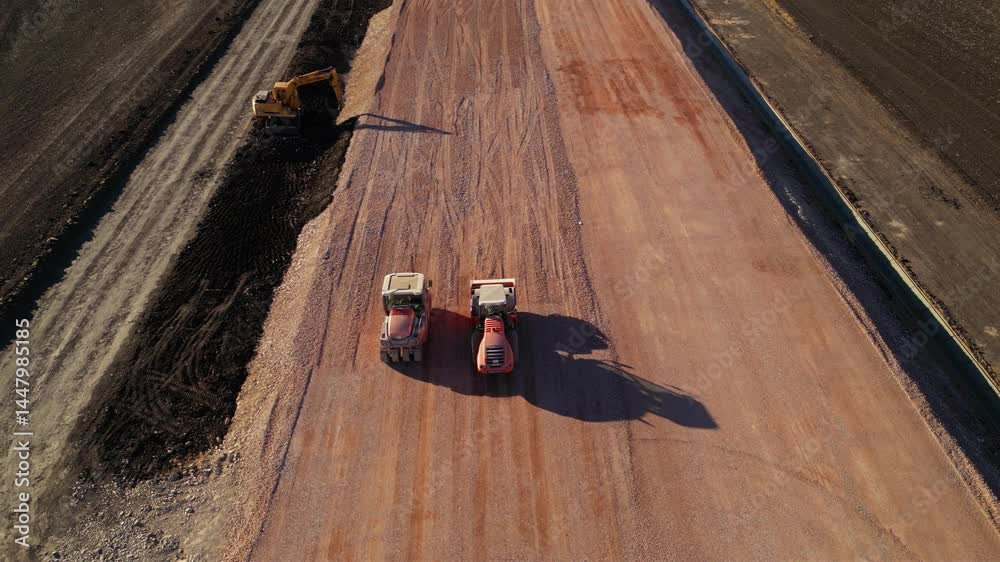 Compactor Top View Top-down aerial image of heavy vibratory compactors working in parallel ...