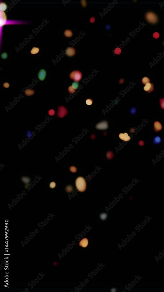 Abstract Colorful Bokeh: Abstract blurred lights create a mesmerizing visual effect against a black background. The vibrant bokeh circles appear in a rainbow of colors.