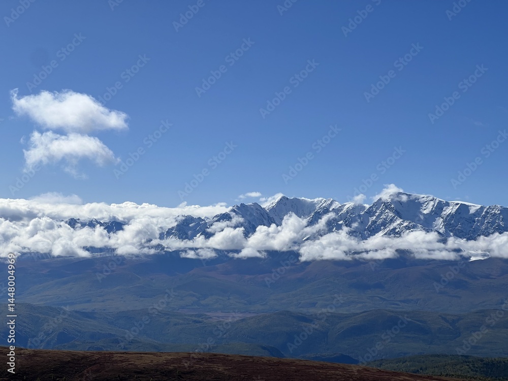 Autumn in the majestic altai mountains with snow-capped peaks and clear blue sky Autumn in the majestic altai mountains with snow-capped peaks and clear blue sky