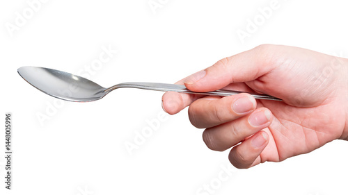 Female hand holding a silver steel spoon isolated on white background.