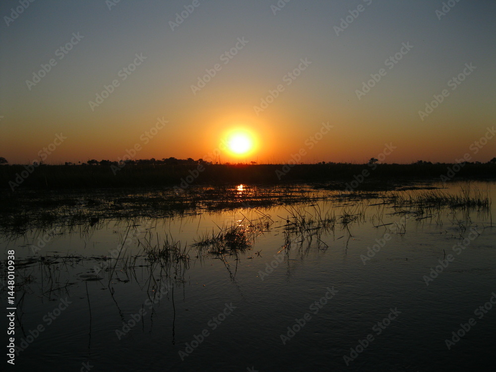 Obraz premium Natural South african river illuminated by Beautiful clear skies sunrise