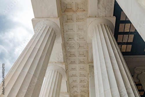 Building with elegant white columns. View from below.