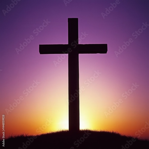 A silhouetted cross stands against a vibrant sunset gradient of purple, orange, and yellow, atop a grassy hill