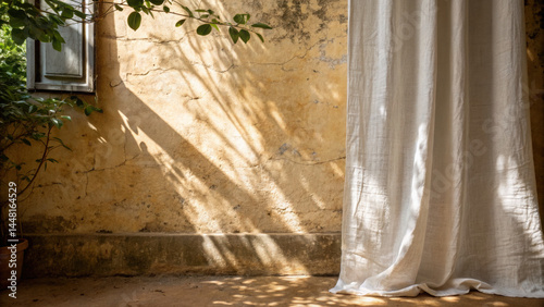Rustic wall texture with linen curtain edges and natural sunlight casting soft shadows, creating warm and peaceful atmosphere in room