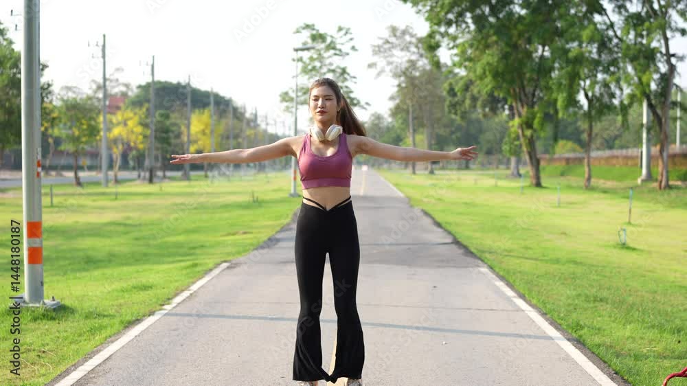 Young Asian woman exercising and doing yoga in nature Young Asian woman exercising and doing yoga in nature