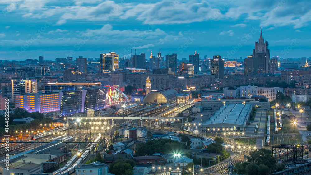 Fototapeta premium Panoramic view to Kiev Railway Station night to day timelapse and modern city in Moscow, Russia