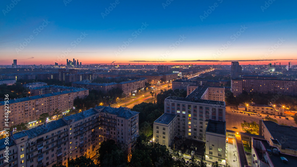 Obraz premium Residential buildings, Stalin skyscrapers and panorama of city before sunrise night to day timelapse in Moscow, Russia