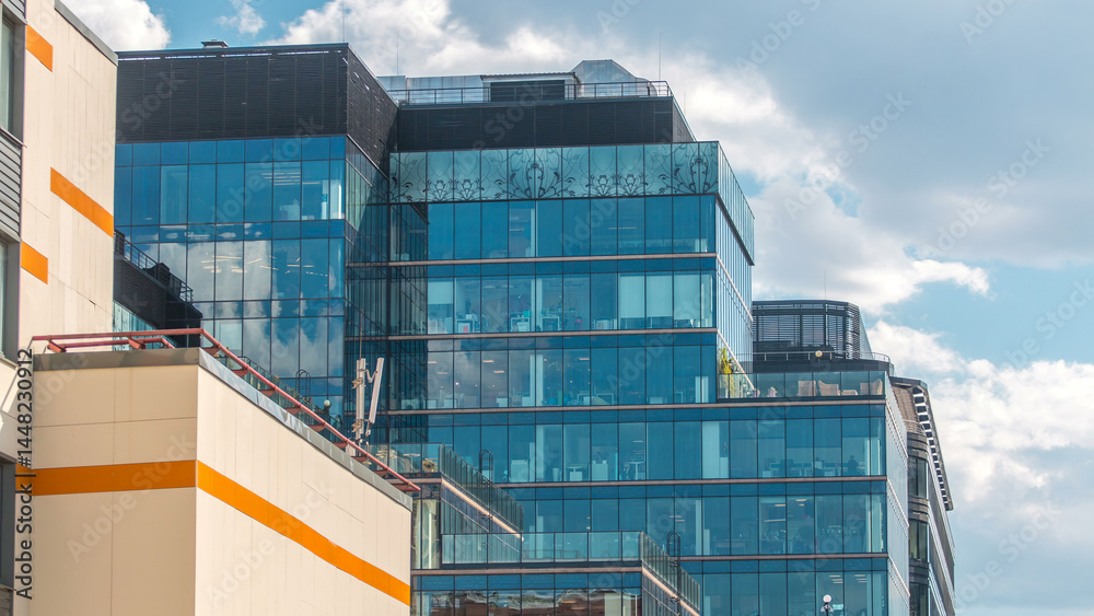 Fototapeta premium Windows in office buildings in Tverskaya Zastava near Temple of St. Nicholas timelapse in Moscow, Russia