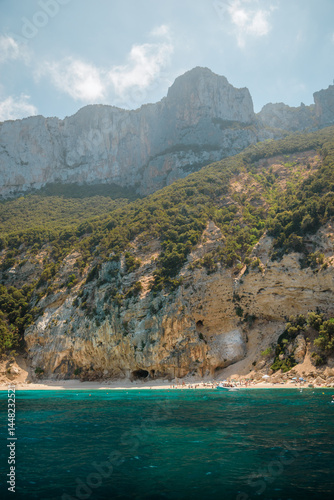 Fototapeta Naklejka Na Ścianę i Meble -  Tourists enjoying stunning cala luna beach in sardinia, italy