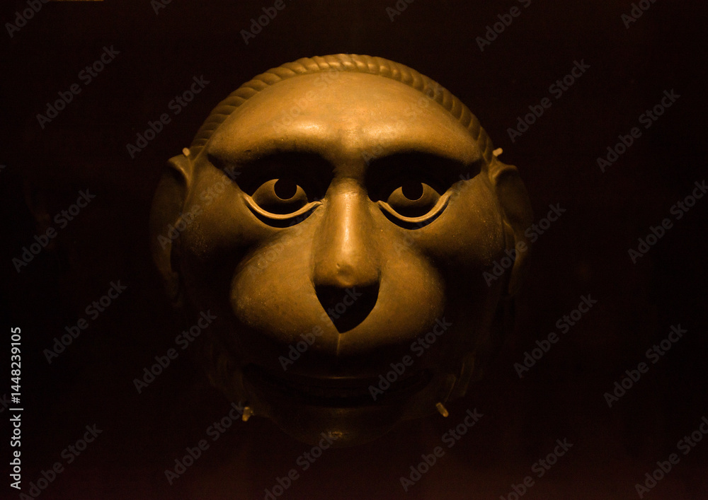 Chinese ancient bronze mask, closeup of photo with depth of field Chinese ancient bronze mask, closeup of photo with depth of field