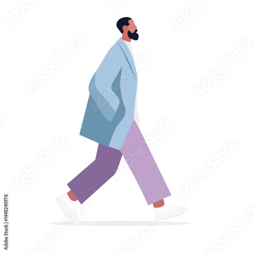Stylish man walking confidently in a modern outfit against a simple background