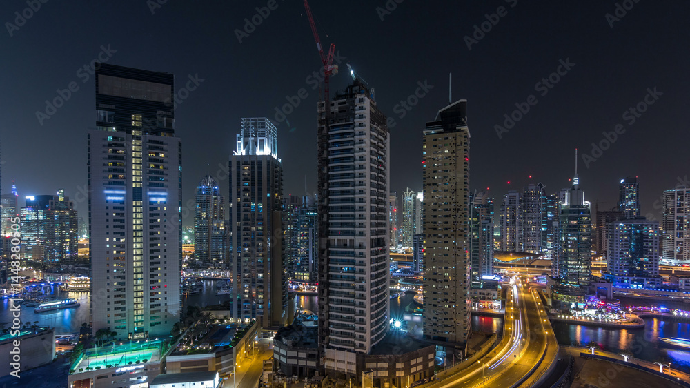 Fototapeta premium Water canal on Dubai Marina skyline at night timelapse.