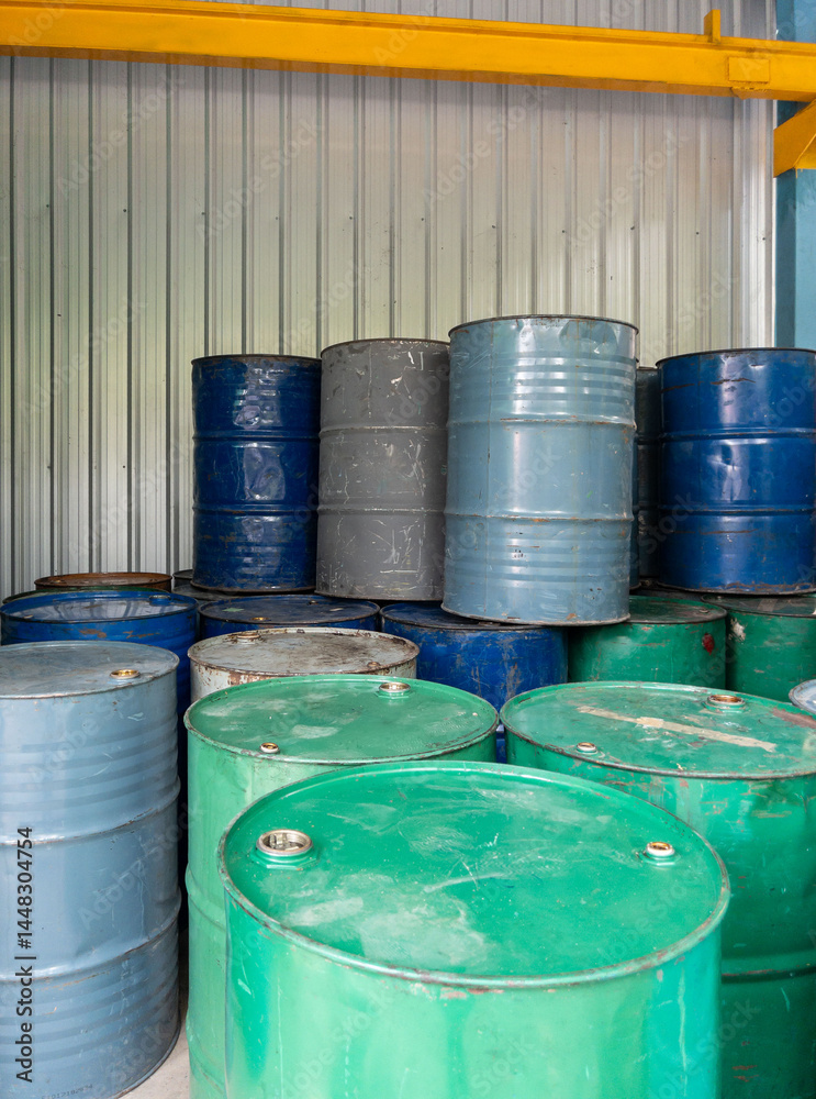 Neatly Arranged Oil Drums in Factory Warehouse.