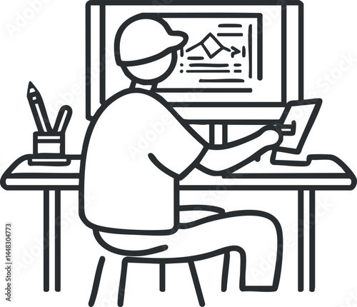 Person working on digital design at a desk with a computer and drawing tablet in office environment