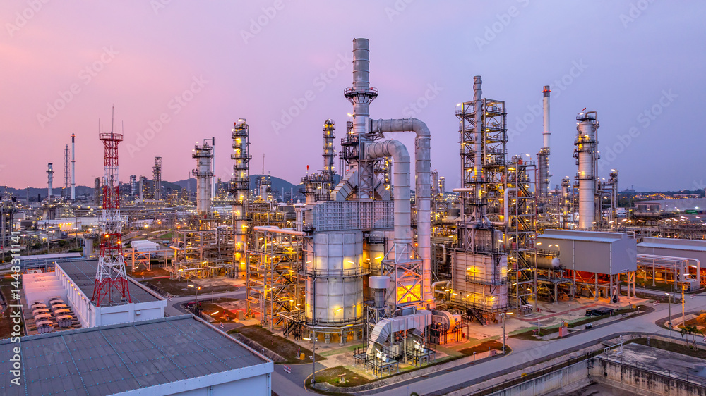 Aerial view oil and gas refinery plant at night, Global business energy logistic transportation, Oil and gas refinery petrochemical industrial, Petrochemical refinery industrial energy supply chain.