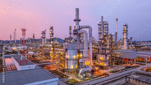 Obraz na płótnie Aerial view oil and gas refinery plant at night, Global business energy logistic transportation, Oil and gas refinery petrochemical industrial, Petrochemical refinery industrial energy supply chain. w salonie