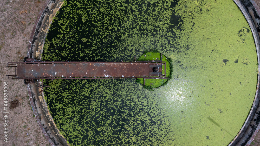 Aerial view westewater treatment tank with wastewater, Circle circular water clarifier cleaning water, Circle water treatment plant circular clarifier, Water treatment plant.