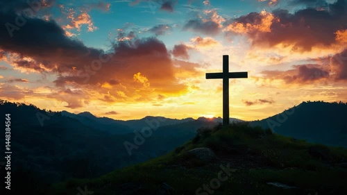 A serene sunset over mountains with a cross symbolizing hope and faith.