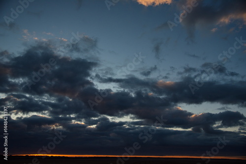 Central Kazakhstan. An unusually gloomy dramatic sunset with dark clouds.