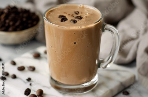 coffee smoothie in transparent glass mug, selective focus