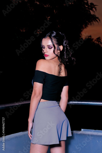 Peruvian, Hispanic, very beautiful young female model modeling clothes, dresses, makeup, outdoors and indoors, also on a ladder modeling, with her queen crown