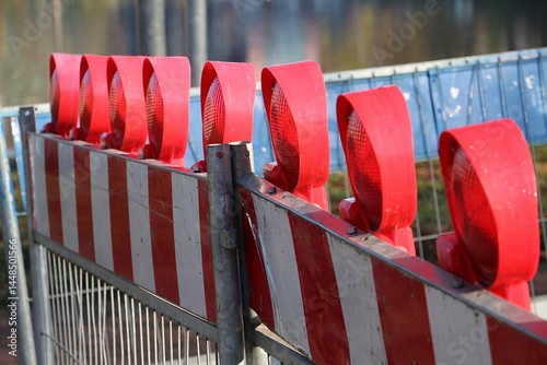 close-up of a construction site barrier with warning lights