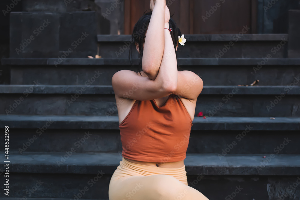 Calm concentrated female in active wear reaching relaxation and inspiration on yoga practice, feeling zen and recreation, pensive woman practicing yoga outdoors enjoying recreating on training