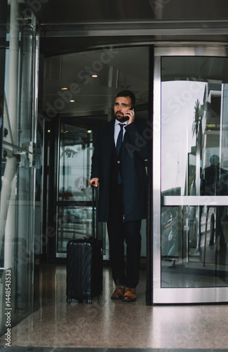 Confident businessman leaving airport