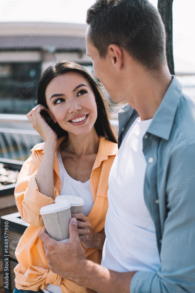 Happy couple in love talking at city riverside