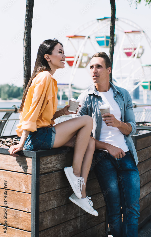 Relaxed guy communicating with girlfriend in street