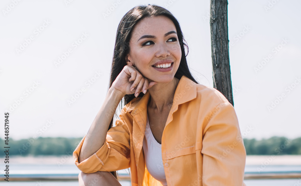 Playful smiling lady chilling on promenade