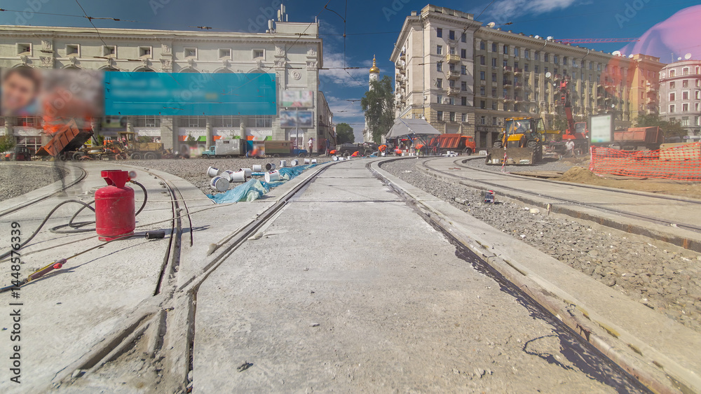 Obraz premium Tram rails at the stage of their installation and integration into concrete plates on the road timelapse