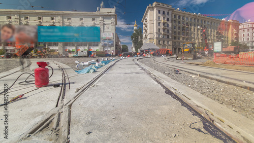 Tram rails at the stage of their installation and integration into concrete plates on the road timelapse photo