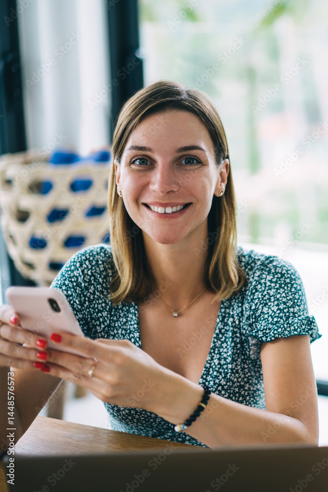 Half length portrait of cheerful caucasian woman blogger looking at camera using modern digital devices and 4G connection, smiling beautiful hipster girl satisfied with online services using delivery