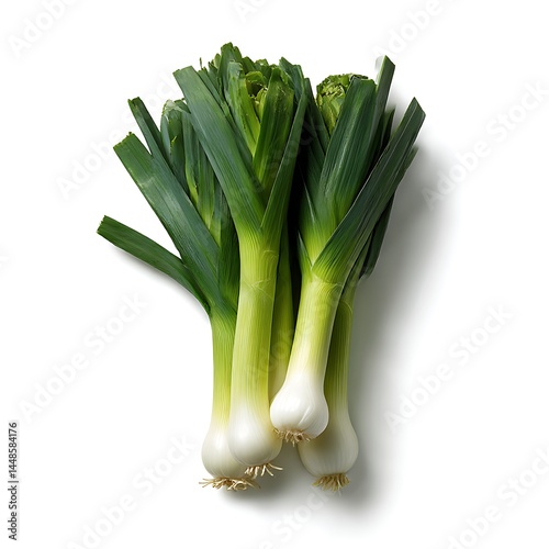A group of four leeks are displayed against a white backdrop