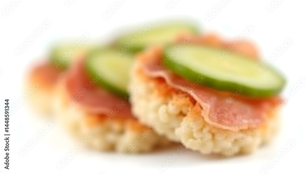 Rice cakes with cream cheese, prosciutto and cucumber isolated on white background Rice cakes with cream cheese, prosciutto and cucumber isolated on white background