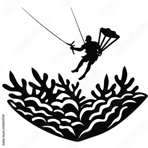 Silhouette of a Parasailor Descending Over Ocean Coral