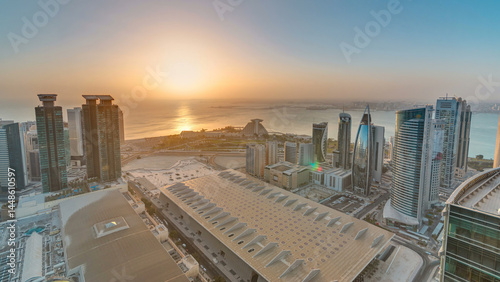 The skyline of West Bay and Doha City Center during sunrise timelapse, Qatar photo