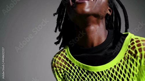 Expressive woman dancing with motion in bright outfit