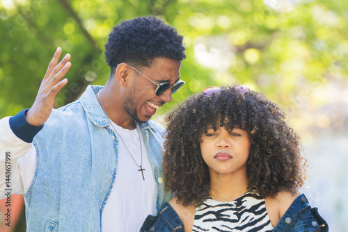 young couple on the street arguing angrily