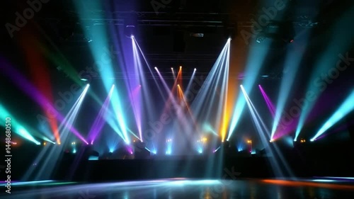 Colorful stage lights flashing in empty venue